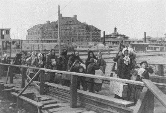 Immigrants entering the United States through Ellis Island, the main immigrant entry facility of the United States from 1892 to 1895
